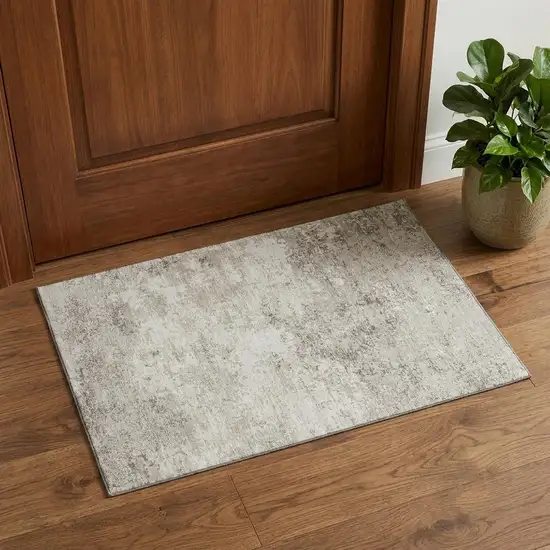 Ivory And Beige Abstract Washable Area Rug With UV Protection Photo 1