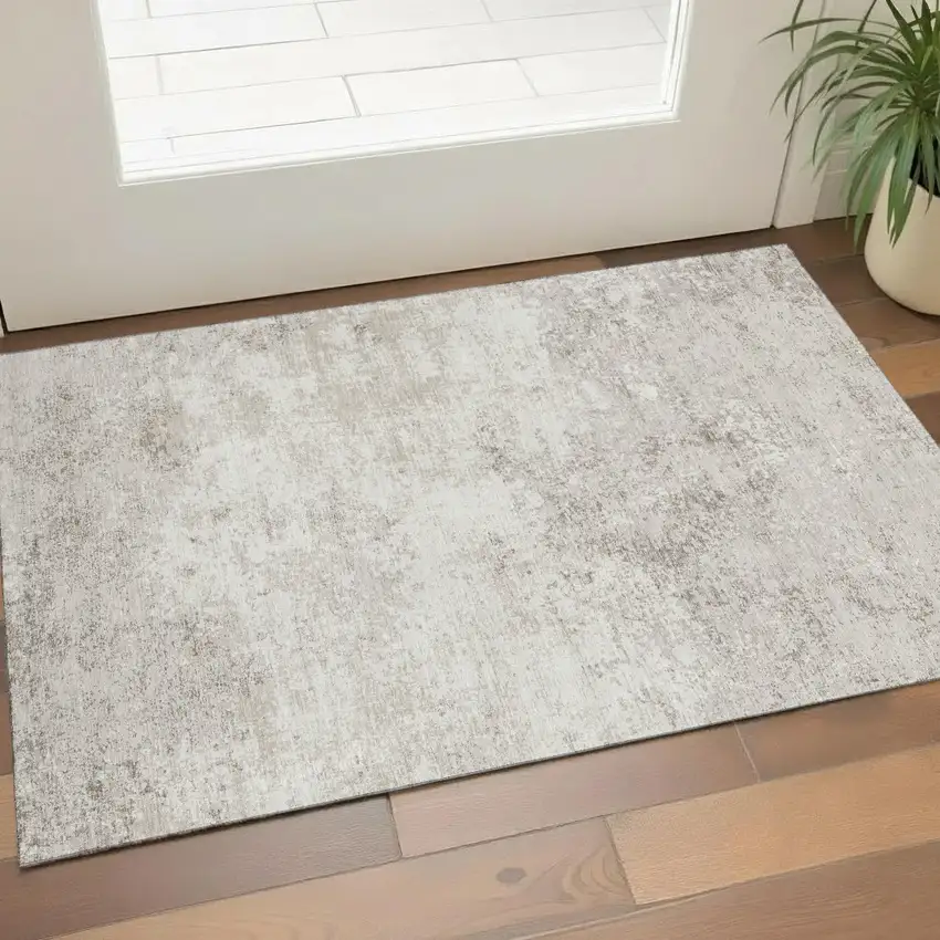 Ivory And Beige Abstract Washable Area Rug With UV Protection Photo 1