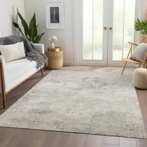 Photo of Ivory And Beige Abstract Washable Area Rug With UV Protection