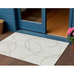 Photo of Ivory And Beige Abstract Washable Indoor Outdoor Area Rug