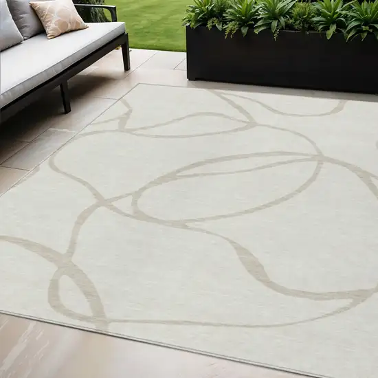 Ivory And Beige Abstract Washable Indoor Outdoor Area Rug Photo 1
