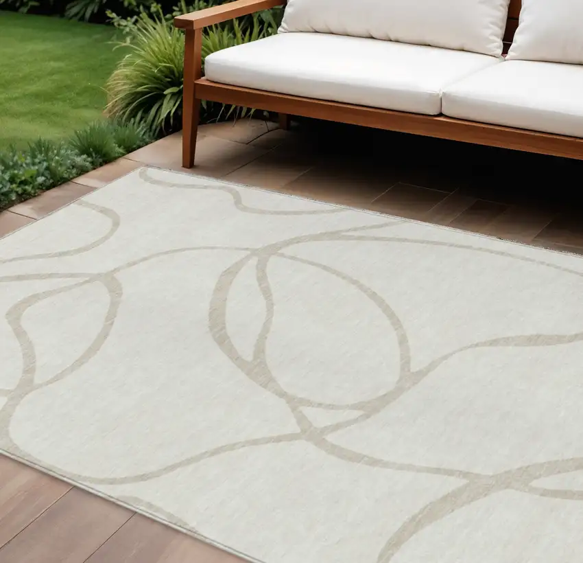 Ivory And Beige Abstract Washable Indoor Outdoor Area Rug Photo 1