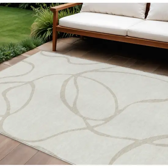 Ivory And Beige Abstract Washable Indoor Outdoor Area Rug Photo 1