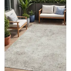 Photo of Ivory And Beige Abstract Washable Indoor Outdoor Area Rug