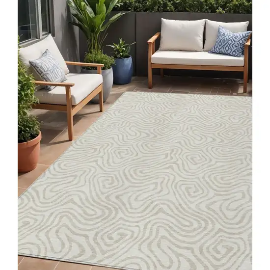 Ivory And Beige Abstract Washable Indoor Outdoor Area Rug Photo 1