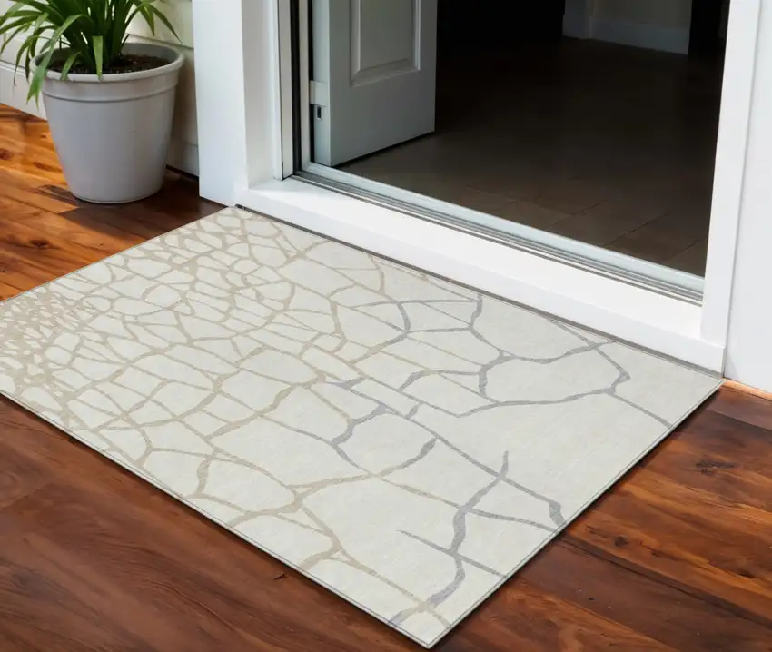 Ivory And Beige Abstract Washable Indoor Outdoor Area Rug Photo 1