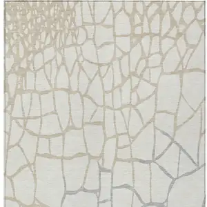 Photo of Ivory And Beige Abstract Washable Indoor Outdoor Area Rug