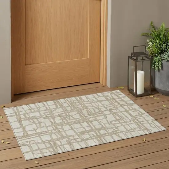 Ivory And Beige Abstract Washable Indoor Outdoor Area Rug Photo 1