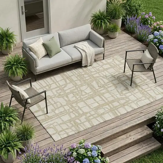 Ivory And Beige Abstract Washable Indoor Outdoor Area Rug Photo 1