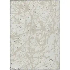 Photo of Ivory And Beige Abstract Washable Indoor Outdoor Area Rug