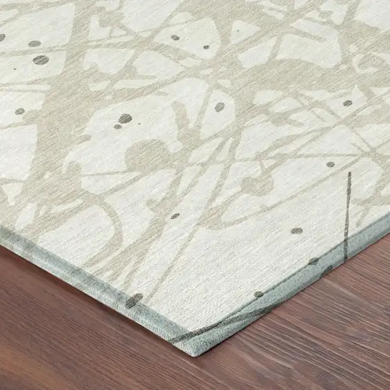 Ivory And Beige Abstract Washable Indoor Outdoor Area Rug Photo 4