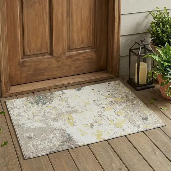 Ivory And Beige Abstract Washable Indoor Outdoor Area Rug Photo 1