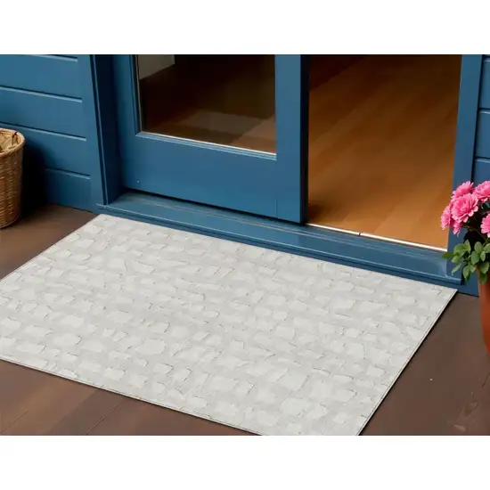 Ivory And Beige Abstract Washable Indoor Outdoor Area Rug Photo 1