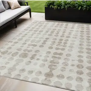 Photo of Ivory And Beige Abstract Washable Indoor Outdoor Area Rug