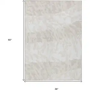 Photo of Ivory And Beige Animal Print Washable Indoor Outdoor Area Rug