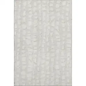 Photo of Ivory And Beige Cobblestone Washable Area Rug With UV Protection