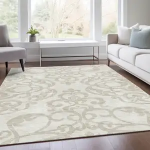 Photo of Ivory And Beige Damask Washable Area Rug With UV Protection