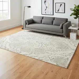 Photo of Ivory And Beige Floral Distressed Non Skid Area Rug
