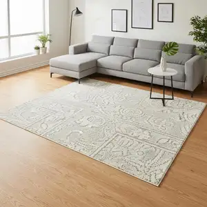 Photo of Ivory And Beige Floral Distressed Non Skid Area Rug