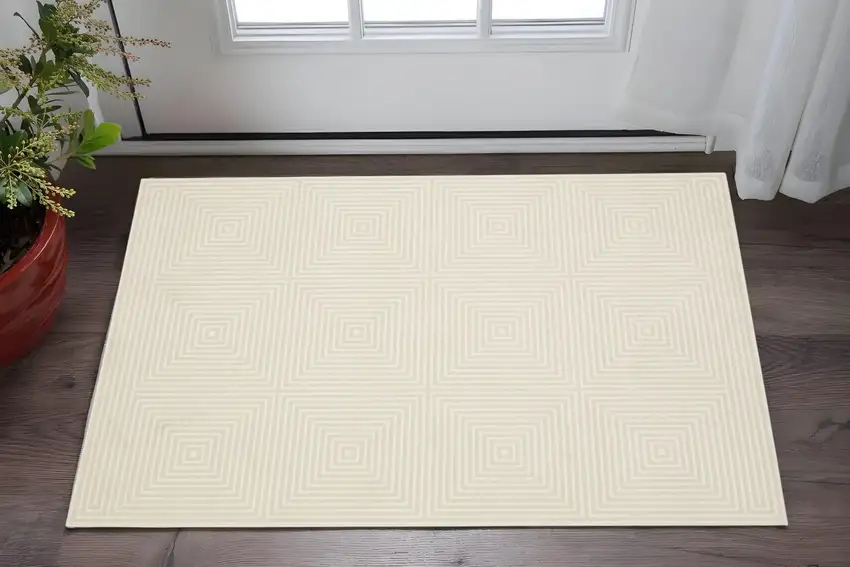 Ivory And Beige Geometric Area Rug Photo 1