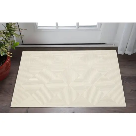 Ivory And Beige Geometric Area Rug Photo 1