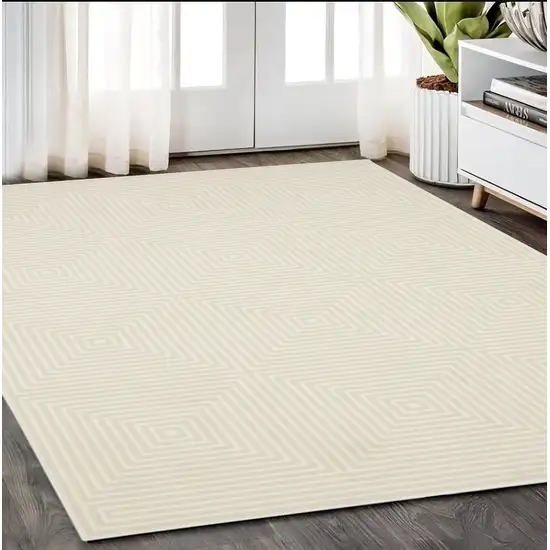 Ivory And Beige Geometric Area Rug Photo 1