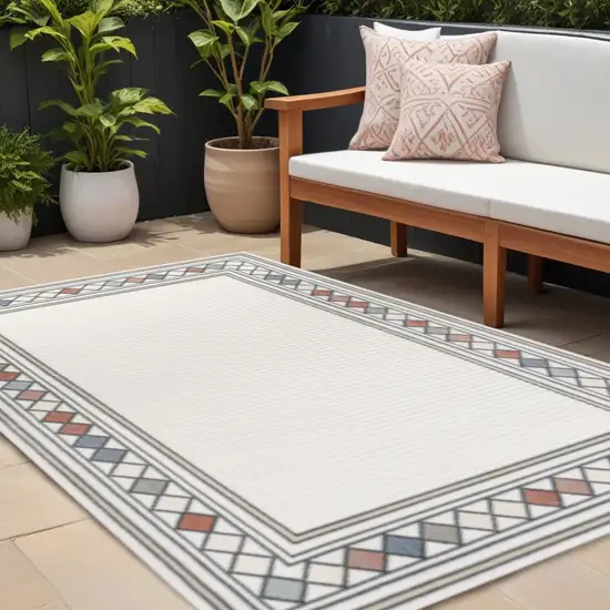 Ivory And Beige Geometric Indoor Outdoor Area Rug Photo 1