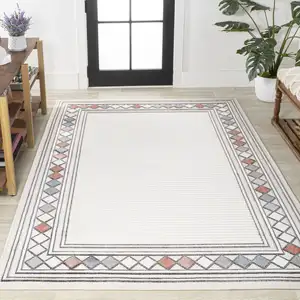 Photo of Ivory And Beige Geometric Indoor Outdoor Area Rug
