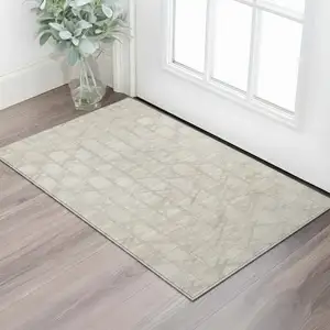 Photo of Ivory And Beige Geometric Washable Area Rug With UV Protection