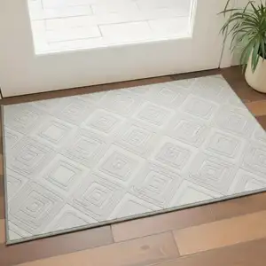 Photo of Ivory And Beige Geometric Washable Area Rug With UV Protection