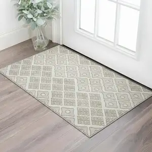 Photo of Ivory And Beige Geometric Washable Area Rug With UV Protection
