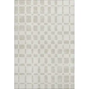 Photo of Ivory And Beige Geometric Washable Area Rug With UV Protection