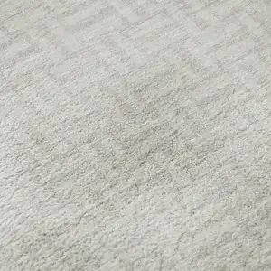 Photo of Ivory And Beige Geometric Washable Area Rug With UV Protection