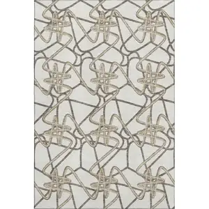 Photo of Ivory And Beige Geometric Washable Area Rug With UV Protection