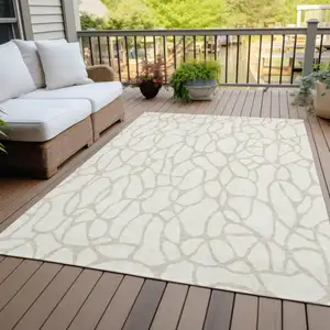 Photo of Ivory And Beige Geometric Washable Indoor Outdoor Area Rug