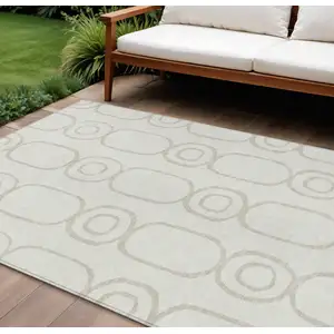 Photo of Ivory And Beige Geometric Washable Indoor Outdoor Area Rug