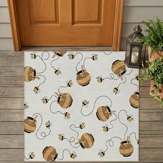 Ivory And Beige Geometric Washable Indoor Outdoor Area Rug Photo 1