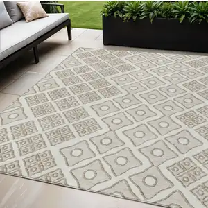 Photo of Ivory And Beige Geometric Washable Indoor Outdoor Area Rug
