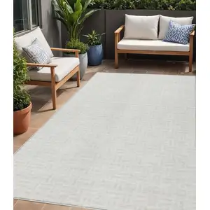 Photo of Ivory And Beige Geometric Washable Indoor Outdoor Area Rug