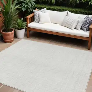 Photo of Ivory And Beige Geometric Washable Indoor Outdoor Area Rug