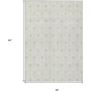 Photo of Ivory And Beige Geometric Washable Indoor Outdoor Area Rug