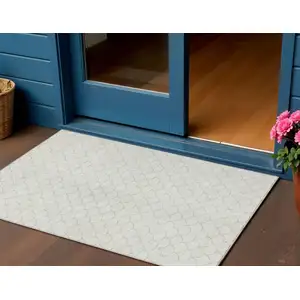 Photo of Ivory And Beige Geometric Washable Indoor Outdoor Area Rug