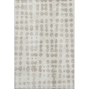 Photo of Ivory And Beige Polka Dot Washable Area Rug With UV Protection
