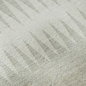 Photo of Ivory And Beige Striped Washable Area Rug With UV Protection