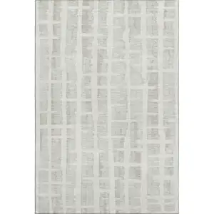 Photo of Ivory And Beige Striped Washable Area Rug With UV Protection