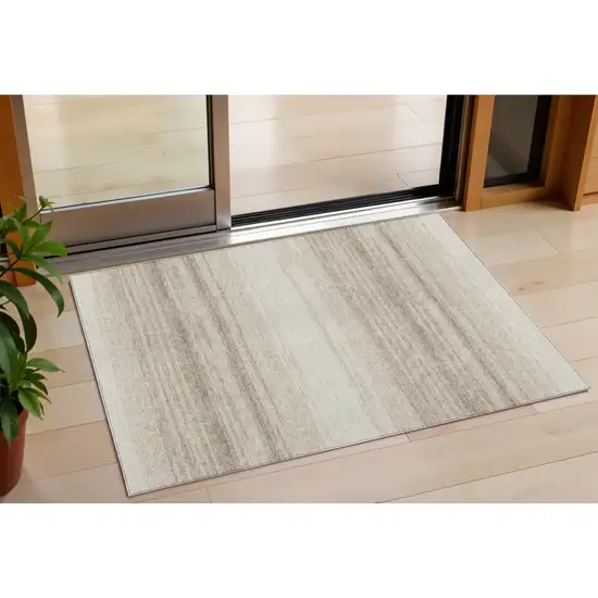 Ivory And Beige Striped Washable Indoor Outdoor Area Rug Photo 1
