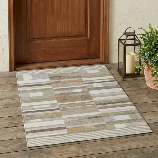 Ivory And Beige Striped Washable Indoor Outdoor Area Rug Photo 1