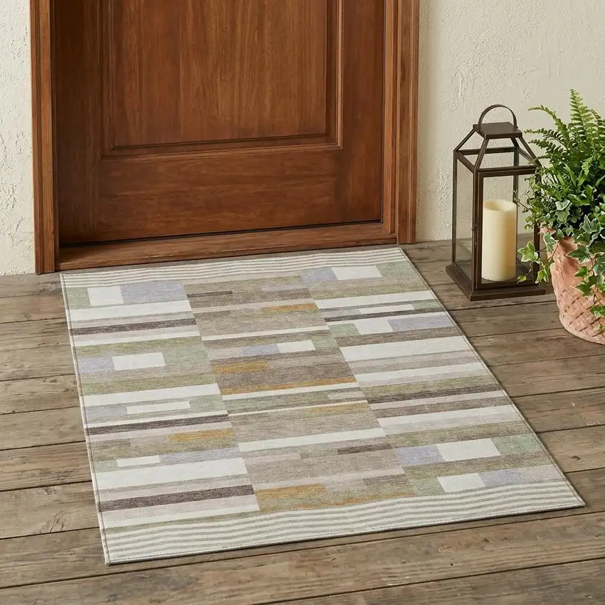 Ivory And Beige Striped Washable Indoor Outdoor Area Rug Photo 1
