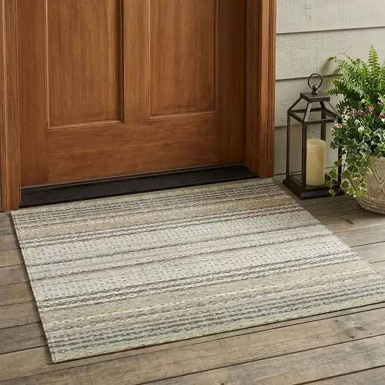 Ivory And Beige Striped Washable Indoor Outdoor Area Rug Photo 1