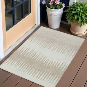 Photo of Ivory And Beige Striped Washable Indoor Outdoor Area Rug